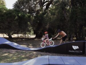 Bike riding on the pump track at Breeze Holiday Parks - Grampians