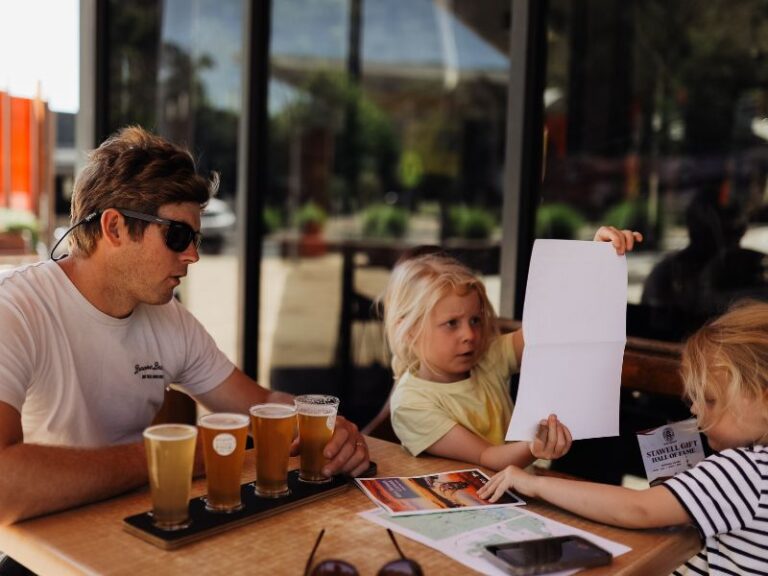 Local events and spring markets, Dad and kids enjoying a beverage in Halls Gap