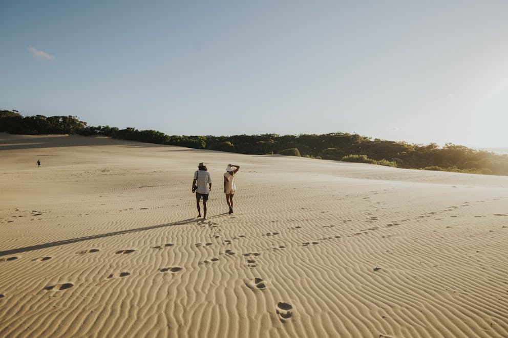 Couple Walking Through Rainbow Beach Holiday Park